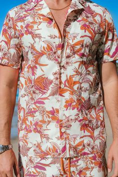 Elevate your summer style with our Coral Flower Tropical Button-Up Shirt for men. The vibrant print exudes tropical vibes, making it an ideal choice for both casual and beach-ready looks. Product code: CBA12A4A002DK Features:  Woven  Collared neckline  Short sleeves  Front buttons  Regular fit Pattern: Tropical Wash Method: Hand Wash Material: 100%POLYESTER. Summer Vacation Button-up Short Sleeve Shirt, Summer Collared Short Sleeve Shirt With All Over Print, Spring Vacation Printed Short Sleeve Shirt, Summer Collared Camp Shirt For Beach, Printed Short Sleeve Shirt For Spring Vacation, Casual Short Sleeve Shirt With All-over Print For Summer, Summer Camp Shirt For Beach With Collar, White Hawaiian Shirt With All Over Print For Vacation, Summer Hawaiian Shirt With Graphic Print