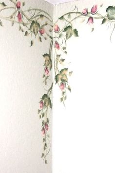 the corner of a room with flowers painted on it