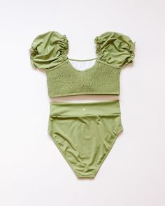 Get ready to make a splash with this fun and flirty Green Smocked Bikini 2pc Women Swimsuit. The smocked detailing adds a touch of playfulness while providing a comfortable and flattering fit. Perfect for lounging by the pool or hitting the beach, this swimsuit will have you feeling confident and stylish all summer long! soft & stretchy，UPF 50+ 87% nylon 13% spandex Fitted Ruched Swimwear For Beach Season, Trendy Fitted Swimwear For Vacation, Fitted Trendy Tankini For Vacation, Fitted Ruched Swimwear For Vacation, Fitted Smocked Summer Top With Elastic Waistband, Fitted Smocked Top With Elastic Waistband For Summer, Elastic Summer Swimwear, Ruched Stretch Swimwear For Beach Season, Stretch Ruched Swimwear For Beach Season