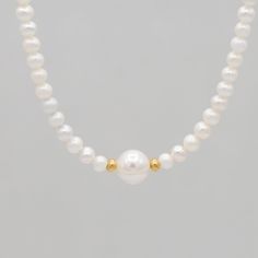 What can you always count on? Pearls to remain timeless year after year. Necklace is made with 6mm freshwater pearls and an 8mm pearl in the center centered between 14k gold filled rondelles. Necklace is finished with spring ring clasp. Measures 16 and 18 inches in length. Everyday Single Strand Pearl Necklace With Round Beads, Everyday Single Strand Pearl Necklace, Classic Akoya Pearl Necklace For Everyday, Dainty Round Bead Pearl Necklace, Rondelle Pearl Necklace With Pearl Charm As Gift, Classic Beaded Necklace With Pearl Pendant, Dainty Single Strand Round Pearl Necklace, Everyday Pearl Drop Beaded Necklaces, Elegant Pearl White Necklace With Spacer Beads