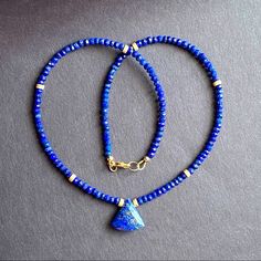 Beaded Choker Necklace Beaded With 3.5mm Genuine Blue Lapis Lazuli Hand Faceted Natural Stone, Accented With Stardust 14k Gold Filled Spacers. And Centered With Lapis Lazuli Pendant * Gemstone : Lapis Lazuli * Metal : All Metal Used Is 14k Gold Filled * Closure : Lobster Clasp * Size: 16” Inches Xmas Christmas Gift Blue Beaded Rondelle Jewelry, Beaded Sapphire Necklace In Lapis Lazuli, Sapphire Beaded Lapis Lazuli Necklace, Handmade Royal Blue Round Beads Jewelry, Lapis Lazuli Rondelle Gemstone Beads Jewelry, Blue Beaded Rondelle Necklaces, Blue Lapis Lazuli Gemstone Beads, Lapis Lazuli Single Strand Beads For Gifts, Blue Gemstone Beads Rondelle Jewelry