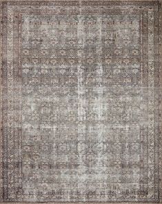 an antique rug with many different colors and patterns