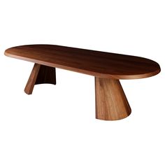 an oval wooden table sitting on top of a white background