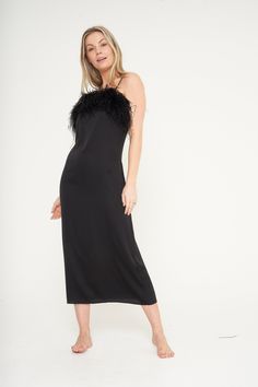 "Our Black Feather Slip Dress is the newest addition to our collection and boasts elegance and femininity. Made from a luxuriously silky material, this dress features a beautiful detachable feather trim on the bust for easy washing. This Dress is both lightweight and breathable, so you'll look and feel fabulous all night long. Wear it around the home or dress it up with a pair of heels for a night out. Fabric Composition 95% Polyester, 5% Spandex Model Height: 5\"6' Size: UK 6-8 wearing a Small Evening Slip Dress For Party Season, Formal Black Evening Dress With Feather Trim, Chic Party Midi Dress With Feather Trim, Fitted Satin Dress With Feather Trim, Glamorous Black Slip Dress For Cocktail, Elegant Feather Trim Dress For Date Night, Elegant Holiday Dresses With Feather Trim, Elegant Feather Trim Dress For Night Out, Elegant Dresses With Feather Trim For Costume Party