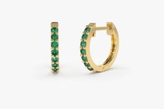 "Natural Emerald Earrings / Huggie Earrings / 14k Gold Emerald Huggie Hoop Earrings / Small Hoop Emerald Earrings / Jewelry Gift Ferko's Fine Jewelry Item Details ✔Made to Order ✔Gold Kt: 14K (also available in 18K) ✔Available Gold Color: Rose Gold, Yellow Gold, White Gold ✔The Inner diameter of Earrings: 10MM ✔The Outer diameter of Earrings: 12MM ✔Round Emerald: 14 pcs 1.5 MM ✔Number of Stones: 14 ✔Total CTW: 0.25 Ctw (Total Carat Weight for the Pair) ✔Ready to Ship in 7-10 Business Days ★ ★ ★ Green 14k Gold Hoop Earrings, Elegant Green 14k Gold Huggie Earrings, Green Huggie Earrings With Prong Setting, Green Small Hoop Earrings Fine Jewelry, Green 14k Gold Hoop Earrings Fine Jewelry, Green 14k Gold Fine Jewelry Hoop Earrings, Green Small Hoop Huggie Earrings Fine Jewelry, Green Huggie Fine Jewelry Earrings, Green 14k Gold Huggie Earrings Gift