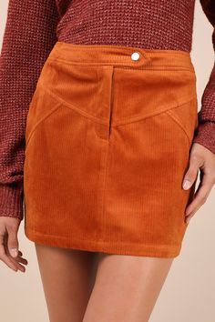 The Lulus Perfected Cuteness Rust Orange Corduroy High-Rise Mini Skirt was made to be paired with chunky sweaters and sleek knee-high boots! Soft ribbed corduroy shapes this trendy skirt that features a high, banded waist with a snap button strap and a hidden zip fly. The A-line silhouette features vintage-inspired, yoke seam detailing across the front, decorative welt pockets at the back, and a flirty mini hem. Fit: This garment fits true to size. Length: Mid-thigh. Size medium measures 15.5" f 70s Mini Skirt, Chunky Sweaters, Trendy Skirts, Rust Orange, Chunky Sweater, School Outfits, Welt Pockets, High Boots, Snap Button