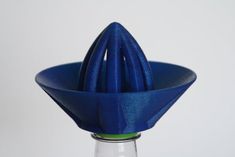 a blue vase sitting on top of a table