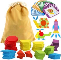 a bag filled with lots of different colored shapes and materials next to a pile of wooden blocks