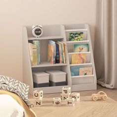 a child's room with toys and books on the floor