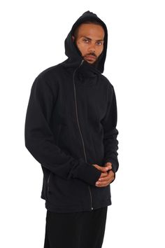 Get streetwear vibes with loungewear feels in the Hilo Mens High Neck Hoodie. Made with super thick organic cotton, this oversized hoodie layers well and is perfect all year round. Style it with your favorite harem pants and it will easily transition from loungewear to streetwear. FEATURES: Hooded High collar zipped up Extra large side zip pockets Asymmetrical zipper Thumbhole cuffs that act like fingerless gloves Oversized relaxed fit Preshrunk Machine washable Crafted from heavyweight 100% org Fleece-lined Hoodie For Streetwear, Urban Fleece Track Jacket For Streetwear, Urban Fleece Track Jacket With Drawstring Hood, Athleisure Hoodie For Everyday Winter Wear, Urban Hoodie With Relaxed Fit For Outdoor, Urban Outerwear With Adjustable Hood, Urban Fleece Track Jacket With Double-lined Hood, Fleece Track Jacket With Double-lined Hood For Streetwear, Outdoor Cotton Hoodie Track Jacket