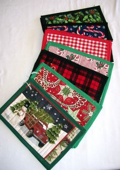 four christmas themed placemats are stacked on top of each other