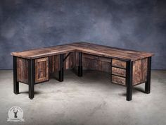 a desk made out of wood and metal with drawers on each side, in front of a gray background