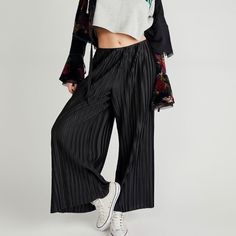 Free People Winona Pleated Flare Pants Size L Add A Timeless Touch Of Texture With These Fun Flares, Featured In A High-Rise, Wide Flare Silhouette With Pleated Paneling Throughout And Soft Sheen Fabrication. Pull-On Design Slouchy Fit Exaggerated Leg Style Care/Import Machine Wash Cold Import Approx Measurement For Size Large Inseam: 28.5 In Rise: 12 In Waist: 31 In Hips: 40in Contents 100% Polyester Black Bottoms With Elastic Waistband For Spring, Spring Black Bottoms With Elastic Waistband, Spring Black Wide Leg Pants With Elastic Waistband, Black Relaxed Fit Pants For Spring, Black Wide Leg Pants With Elastic Waistband For Spring, Black Wide Leg Bottoms For Spring, Spring Black Pants With Elastic Waistband, Black Pants With Elastic Waistband For Spring, Black High-waisted Wide Leg Pants For Spring