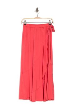 A pretty faux wrap midi skirt features ruffled trim for effortless feminine style. Spring Rayon Maxi Skirt With Ruffles, Spring Ruffle Rayon Maxi Skirt, Spring Ruffled Rayon Maxi Skirt, Spring Ruffled Rayon Skirt, Flowy Ruffled Bottoms In Rayon, Flowy Rayon Bottoms With Ruffles, Summer Viscose Skirted Bottoms, Flowy Ruffled Rayon Bottoms, Summer Skirted Bottoms In Viscose