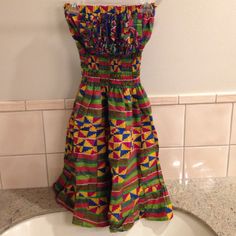 Brand New, Never Worn, No Tags. Custom Ordered And Handmade Dress From Ghana, Purchased While On A Trip. Very Colorful And Festive. Skirt Is Great For Twirling Around. Entire Length Of Dress Between 35-36 Inches Long. Because Of Smoked Material, Can Fit Xs-M. Multicolor Maxi Sundress With Smocked Back, Multicolor Smocked Back Maxi Sundress, Multicolor Sundress With Smocked Back, Multicolor Maxi Dress With Smocked Bodice For Vacation, Beach Smock Sundress In Mini Length, Beach Sundress With Smock Detail In Mini Length, Beach Smock Sundress Mini Length, Beach Multicolor Maxi Dress With Smocked Back, Fitted Cotton Smocked Bohemian Dress