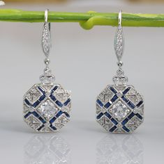 Vintage Art Deco Earrings, Drop Dangle Diamond Earrings, Engagement Wedding Earrings, Round & Sapphire Diamond 14K White Gold Over Earrings **Returns and Refunds** 30-Day Returns All our diamonds have Paid 6 Months grantee! We are fully behind every diamond and piece of jewelry that we sell. It is vital for us that you are totally happy with your purchase. If you are not 100% happy with your purchase, you can return it to us within 30 days of purchase for a full refund or exchange. Happy Shopping With VNVJEWELS ✶ Our All Jewelry Is handcrafted In such a way that it gives special touch to your dream gift. Thank You Visit Again 𝐂𝐀𝐍𝐂𝐄𝐋𝐋𝐀𝐓𝐈𝐎𝐍𝐒 𝐏𝐎𝐋𝐈𝐂𝐘 We Charge 10% of Order Value if any Order Canceled Within 24 Hours of Purchase. We Charge 20% of Order Value if any Order Canc Exquisite White Gold Dangle Earrings, White Gold Hand Set Drop Earrings, Hand Set White Gold Drop Earrings, Fine Jewelry Hallmarked Bridal Drop Earrings, Diamond Cut Chandelier Drop Earrings For Anniversary, White Gold Dangle Earrings For Anniversary, Wedding Dangle Hoop Earrings Diamond Cut, Art Deco Pierced Earrings For Formal Occasions, Art Deco Style Pierced Earrings For Formal Occasions