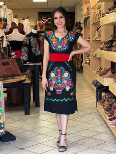 -This Beautiful Long Mexican Colorful Floral Dress is the perfect dress for a fun night out or a special event. -It is full of colorful embroidered flowers and has some crocheted details. -This dress has ties on the back in order to adjust the fit. - You can purchase the dress either with or without the belt. Please note: The accesories shown with this dress may purchased as well and Can be found in this links Earrings:https://www.etsy.com/es/listing/855938626/aretes-mexicanos-de-filigrana-arete Embroidered Short Sleeve Fiesta Dress, Fiesta Embroidered Short Sleeve Dresses, Traditional Black Fiesta Dress, Traditional Black Dress For Fiesta, Fitted Traditional Dress For Fiesta, Fitted V-neck Dress With Multicolor Embroidery, Fitted Dress With Multicolor Embroidery For Fiesta, Black Short Sleeve Dress For Fiesta, Fitted Black Dress For Fiesta