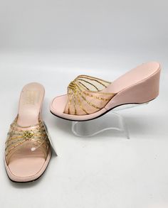 1950s Sz:6 Pink Vinyl Clear Tri-Tone Floral Top Stripe Peep Toe Wedge House Slipper Brand: Adriana Measurements: Interior Length: 9 1/4" Interior Width: 3" Exterior Width:  3 3/8" Wedge Height: 2 1/2" Condition: Shoes are in good vintage condition. Signs of wear in the stripe detailing. See photos for reference. Vinyl is slightly stiff. Insole and sole still in good shape. Shoes are still in wearable condition. Vintage Wedge Sandals For Spring, Vintage Wedge Heel Sandals For Spring, Vintage Open Toe Wedge Sandals For Spring, Vintage Wedge Sandals For Formal Spring Occasions, Vintage Wedge Sandals For Spring Formal, Spring Vintage High Heel Wedge Sandals, Vintage High Heel Wedge Sandals For Spring, Spring Vintage Wedge Heel Heels, Spring Vintage Wedge Heels