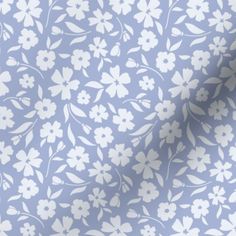 a blue and white flower pattern on fabric