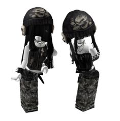 two black and white dolls wearing hats with skulls on the top one is holding a cup