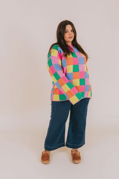 Fashionably transition between seasons in this vibrant PLUS SIZE - Between Places Sweater! With its cheerful multi-colored checker pattern, ribbed neckline, and pullover style, you can make a statement while staying comfortable. Details Multi-color blocked checker pattern Pullover sweater Ribbed neckline Colors are pink, blue, lime, orange, and green Sizing *Measurements are taken unstretched with item hanging* Approximate measurements: SIZE LENGTH BUST 1XL 29.5" 54" 2XL 30" 56" 3XL 30.5" 58" Fa Playful Fall Tops In Bright Colors, Plus Size Colorful Outfits, Nursing Friendly Tops, Free People Sandals, Nursing Friendly Dress, Plus Swim, Plus Jumpsuit, Checker Pattern, Plus Size Sweater