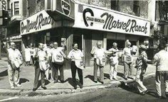 an old black and white photo of people standing in front of a movie ranch store