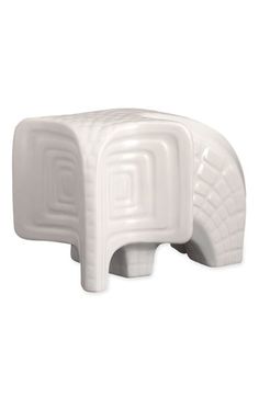 an elephant shaped stool is shown against a white background with the shape of a foot rest