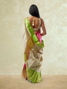 Embrace traditional elegance with our Pink and Green Fancy Patola Saree from the Sarees collection. This exquisite saree features a stunning combination of pink and green colors in a fancy Patola design, exuding grace and charm. The intricate detailing and vibrant hues make it a perfect choice for festive occasions and special events. Care Instructions: Dry clean only to maintain the fabric's quality and colors. Pink Tissue Silk Pre-draped Saree With Self Design, Pink Pre-draped Saree With Dupatta In Tissue Silk, Festive Pink Raw Silk Pre-draped Saree, Pink Tissue Silk Saree For Eid, Pink Tissue Silk Pre-draped Saree For Festivals, Designer Raw Silk Pink Saree, Pink Tissue Silk Saree With Traditional Drape, Pink Raw Silk Pre-draped Saree For Puja, Pink Tissue Silk Traditional Wear With Pallu