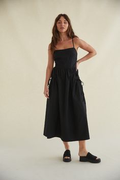 black tie back maxi dress - black maxi dress for spring and summer Midi Length Drawstring Dress For Day Out, Black Midi Dress With Slip Pockets, Chic Midi Dress With Pockets And Spaghetti Straps, Spaghetti Strap Dress With Tie Waist For Day Out, Black Daywear Dress With Slip Pockets, Midi-length Suspender Dress With Tie Straps For Day Out, Black Summer Dress With Tie Fastening, Midi Sundress With Drawstring, Sundress With Drawstring Midi Length