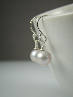 "Silver Pearl Earrings, Sterling Silver, Freshwater Pearls, Elegant, Classic by Shiny Little Blessings on Etsy. ★ This item is created with the highest quality sterling silver, NEVER plated! Best bet for all skin types and those with metal sensitivities. Your best choice for lasting quality. ★ Each pair of earrings comes individually gift wrapped and with a message card for convenient and loving gift giving. Let me know during check-out if you would like to add a personal message to the gift wra Pearl White Dangle Earrings For Everyday, Pearl White Drop Earrings For Everyday Wear, Everyday Pearl White Drop Earrings, Pearl White Round Earrings For Everyday, Handmade Minimalist Pearl White Earrings, Handmade Pearl White Minimalist Earrings, Simple White Drop Earrings, Simple White Round Earrings, Simple White Nickel-free Earrings