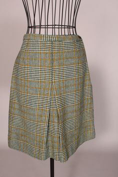 "60s Skirt // Mini Skirt Wonderful vintage 60's green and yellow plaid mini skirt with cute front pleat, by Scaasi for Lortogs! So cute, and in great condition! Waist:24\" Hips:38\" Length:19\" Label: Scaasi for Lortogs 2016-12" Retro Pleated Skort Of Short Length, Green Pleated Skort For Workwear, Green Pleated Skort For Work, Retro Green Mini Length Skort, Retro Green Mini Length Bottoms, Retro Short Pleated Skirt, Vintage Mini Skort For Fall, Retro Plaid Skirt For Work, Retro Pleated Skort