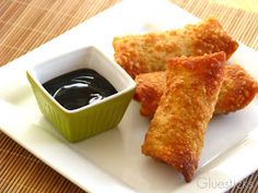 some fried food on a plate with dipping sauce