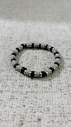 Men's bracelet, with black and grey clay beads and silver flat bead Wrist size 6.5 Seed Bead Bracelets For Guys, Clay Bracelet For Men, Guy Beaded Bracelets, Mens Bracelet Beads, Men's Beaded Bracelets, Clay Bead Bracelet Ideas For Men, Men Beads Bracelet, Mens Beaded Bracelet, Boy Beaded Bracelets