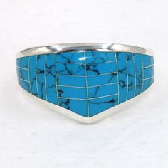 "Large beautiful blue faux turquoise sterling silver hinged cuff bracelet.  Marked 925.  Certain to be a treasure in your personal jewelry collection. FREE SHIPPING! Details:  Sterling Silver: (as shown in picture) Faux Turquoise: inlay Approximate Dimensions: 1 1/2 inch wide at top, inside circumference is 6 3/4 inches Wrist Size: 6 - 6 1/2 inches  Total Weight: 78.0 grams FREE domestic shipping by USPS Priority Mail delivery confirmation and includes insurance. If the item is to be shipped internationally Etsy will calculate postage. Please notify us at purchase if you are buying more than one item and we will gladly combine shipping. 7 day \"no hassle\" return policy money back guarantee. If for any reason you are not 100% thrilled with your purchase, please contact us and we will gladl Adjustable Blue Cuff Bracelet For Anniversary, Blue Inlay Bracelet Jewelry, Blue Inlay Bracelet, Adjustable Blue Inlay Cuff Bracelet, Adjustable Blue Cuff Bracelet With Inlay, Southwestern Blue Cuff Bracelet As Gift, Southwestern Style Blue Inlay Bracelets, Southwestern Style Nickel Free Blue Cuff Bracelet, Southwestern Blue Nickel-free Cuff Bracelet