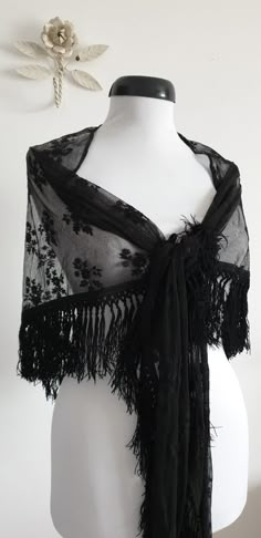 "Vintage 1930s black lace shawl with floral embroidery and black fringe. ....M E A S U R E M E N T.... 101\" in full width 25\" from center of straight edge to tip of fringe 4\" fringe brand/maker: n/a condition; excellent( see last photo ) Shipping Is Avaliable Worldwide. Every item is carefully shipped Priority via Air Mail - shipping takes from 7 to 14 working days, depending on your location. Shipping includes Tracking. Come and check out our shop to see all items! https://www.etsy.com/shop/ Black Ruffled Shawls, Black Lace Shawl Weddings, Crochet Lace Shawl Black, Luxury Black Bohemian Shawl, Black Rose Shawl, Cheap Vintage Shawl, Victorian Shawl 19th Century, 1930s Gothic Fashion, Black Lace Shawl