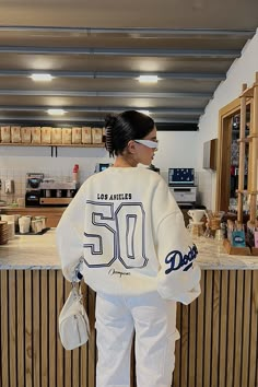 Dodgers LA Sweatshirt Oversized White Varsity Sweatshirt, White Oversized Varsity Sweatshirt, Sporty Tops For Weekend, Sporty Oversized Tops With Letter Print, Oversized College Style Tops For Loungewear, Sporty Oversized Sweatshirt With Back Print, Oversized Sporty Sweatshirt With Back Print, Trendy Oversized White Sweatshirt, Oversized Tops With Letter Print