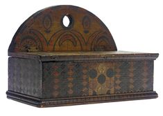 an old wooden box with decorative designs on it