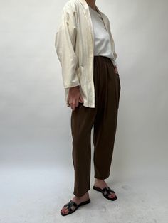 The versatile Lena Pant, created in our durable and cozy silk canvas, is an essential addition to any wardrobe. Boasting a comfortable elastic waist, attractive front pleats, convenient side pockets, and a stylish cropped leg, the Lena Pant is perfect for any occasion. Our highly sought-after Lena Pant is now even more luxurious with its new design in pure silk, maintaining the same trusted quality and texture. 100% Silk Made in USA Available in 26" inseam and 29" ( Full Length ) *If you’re in-b Versatile Tapered Leg Harem Pants For Loungewear, Relaxed Fall Daywear Bottoms, Relaxed Fit Pants With Gathered Waist For Spring, Tapered Leg Pants With Elastic Waistband For Daywear, Spring Parachute Pants With Elastic Waistband For Everyday, Fall High-waisted Relaxed Fit Parachute Pants, Relaxed Fit High-waisted Parachute Pants For Fall, High-waisted Parachute Pants For Fall, Versatile Relaxed Fit Parachute Pants For Fall