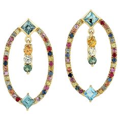 Cast from 18K gold, these multi gemstone earrings are true stunners. It is hand set with 1.42 carats sapphires and .95 carats topaz. FOLLOW MEGHNA JEWELS storefront to view the latest collection & exclusive pieces. Meghna Jewels is proudly rated as a Top Seller on 1stdibs with 5 star customer reviews. All items manufactured by us are handmade and can be customized or redesigned. Composition Size-27X15 MM Total Weight-5.58 Gold Weight(Gms)-5.106 Sapphire Wt(Cts)-1.42 Topaz Wt(Cts)-0.95 Sparkly Jewelry, Art Nouveau Design, Stone Earrings, Gemstone Earrings, Diamond Bracelet, Beautiful Earrings, Precious Stones, Topaz, Gold Earrings