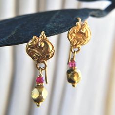 "These are exotic, dainty ethnic 18K gold earrings, lightweight and comfortable to wear. The Spinel (more valuable than ruby)  bead sets off the gold Just barely under 1\" long." Gold Ruby Temple Jewelry Earrings, 22k Gold Peacock Design Earrings For Ceremonial Occasions, Temple Jewelry Style Ruby Earrings In Yellow Gold, Yellow Gold Ruby Temple Jewelry Earrings, Gold Ruby Earrings With Latkans, Elegant Gold Earrings With Peacock Design, Gold Dangle Jewelry With Peacock Design, 22k Gold Peacock Design Earrings For Ceremonial, Gold Ruby Briolette Jewelry