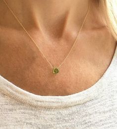 "This genuine peridot gemstone sits on a dainty and minimalist 14k gold filled, sterling silver, rose gold filled, or 14k gold chain. Subtle and simple, this beautiful semi-precious stone necklace is perfect by itself or for layering with other necklaces. Peridot is the August birthstone necklace and would make the perfect birthday gift. Available in many gemstones and birthstones in the drop down menu. Model is wearing the peridot necklace in 16\" gold filled. Jewelry is handmade by us in our NYC studio. We focus on craftsmanship and quality using only the highest quality materials and handpicked genuine gemstones.  PACKAGING We take pride in creating beautifully packaged orders. Jewelry arrives delicately wrapped in tissue and placed in a kraft box inside a logo drawstring pouch. Your pa Everyday Fine Jewelry Green Necklaces, Everyday Fine Jewelry Green Necklace, Green Fine Jewelry Necklace For Everyday, Green 14k Gold Filled Jewelry With Delicate Chain, Delicate Green 14k Gold-filled Jewelry, Minimalist 14k Gold Charm Necklaces With Gemstone, Minimalist 14k Gold Gemstone Charm Necklace, Minimalist Gemstone Necklaces For May Birthstone, Delicate Green Charm Necklaces With Delicate Chain