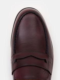 Color: bordeaux Cow leather with natural finish Penny front Leather insoles Rubber and leather soles Hand-stitched detailing Red Moccasins With Rubber Sole For Business, Red Calf Leather Loafers For Business, Red Calf Leather Business Loafers, Luxury Burgundy Leather Shoes With Rubber Sole, Burgundy Leather Shoes With Leather Sole, Burgundy Leather Wingtip Shoes, Burgundy Leather Dress Shoes With Leather Sole, Burgundy Leather Shoes With Leather Sole For Galas, Burgundy Almond Toe Dress Shoes With Leather Sole