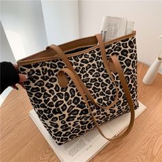 This animal print shoulder bag is perfect for your daily life. It features an animal print design and is made from high-quality materials. Made of high-quality materials, this tote bag features a zipper closer so you won't have to worry about any unwelcome intruders while carrying your personal items. Animal Print Handbags, Animal Print Tote Bags, Aesthetic Bags, Animal Print Design, Printed Canvas Tote Bag, Casual Tote Bag, Trendy Tote Bags, Diy Tote Bag, Black Leopard Print