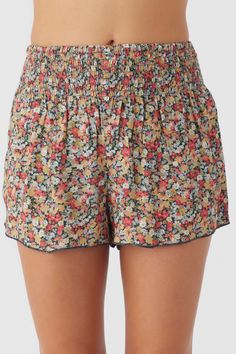 Cute and essential pull-on short that has an allover print design, smocked elastic waist and flowy fit. O'Neill Women's woven short 2.5" Inseam 13" Rise Smocked waistband Allover print 100% Viscose Casual All Over Print Spring Bottoms, Relaxed Fit Bottoms With All Over Print For Spring, Multicolor Vacation Shorts With Elastic Waistband, Beach Floral Print Stretch Shorts, Stretch Floral Print Shorts For Beach, Stretch Floral Print Beach Shorts, Spring Beach Shorts With Smocked Back, Summer Beach Shorts With Pull-on Style, Spring Beach Shorts With Pull-on Style