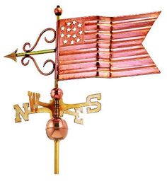 a weathervane with an american flag on it's side and the word w & s written in gold