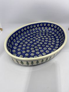 a blue and white bowl sitting on top of a table