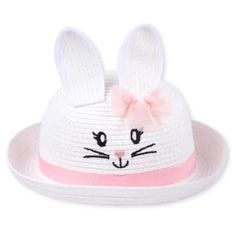 a white hat with pink ribbon and ears