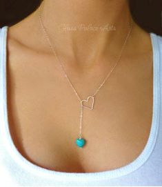 "Turquoise Heart Clasp-less Lariat Necklace Dainty and sweet ~ the small turquoise heart and larger open heart loop are a match made in heaven. The perfect gift for your sweetie! *See important measuring instructions below - A gorgeous and bright turquoise magnesite heart shaped stone measures 10mm - Chain is a shimmery and light 14k gold fill, rose gold fill or 925 sterling chain - Heart pendant is either sterling silver, rose gold fill or 14k gold fill and measures 15mm - Total length of neckl Elegant Turquoise Heart Beads Jewelry, Elegant Turquoise Jewelry With Heart Beads, Adjustable Turquoise Heart Pendant Jewelry, Turquoise Lariat Necklace As A Gift, Turquoise Lariat Necklace Gift, Elegant Turquoise Heart Necklace For Gift, Turquoise Heart-shaped Wedding Jewelry, Turquoise Heart Wedding Jewelry, Handmade Turquoise Lariat Necklace Gift