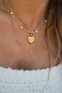 Gold Plated Heart Charm Necklace Length of Necklace: approx. 16 - 18 inches (adjustable) Gold plated Stainless Steel Adjustable Heart Shaped Clavicle Chain Necklaces, Dainty Adjustable Heart Pendant Necklace, Heart Pendant Locket Necklace With Adjustable Chain, Adjustable Heart Pendant Locket Necklace, Adjustable Locket Necklace For Valentine's Day, Gold Heart Beaded Choker Jewelry, Adjustable Heart-shaped Delicate Chain Necklace, Adjustable Delicate Heart Chain Necklace, Gold Heart Beads Choker Jewelry