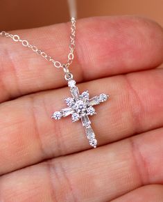 "This is a beautiful dainty crystal cross necklace for women or little girls! Cross is 14k white gold filled with CZ crystals, measures 20x16mm. Comes on a 925 sterling silver shiny cable chain. This cute cross pendant and necklace sparkles with movement! Comes nicely boxed, the perfect gift! *Necklace in picture is a 16\" length. Also comes in gold version shown (cross charm chain are 14k yellow gold filled)." Silver Cross Necklace Woman, Cross Pendant Necklace Woman, White Gold Cross Necklace, Cross Necklace For Women, Cross Necklace Women, Cross Gold, Clean Sterling Silver, Silver Cross Necklace, Sterling Silver Cross Necklace